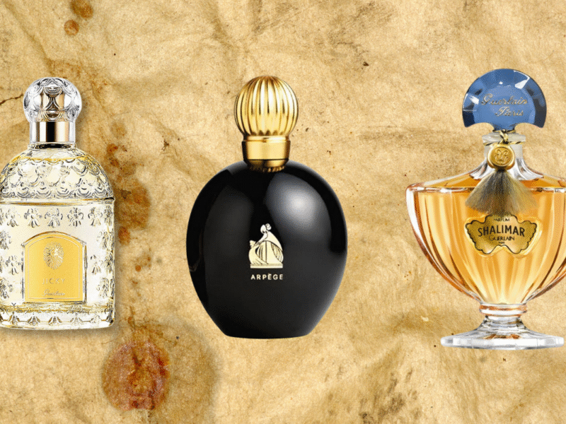 A weathered background containing 3 perfumes- Guerlain Jicky, Lanvin Arpege, Guerlain Shalimar