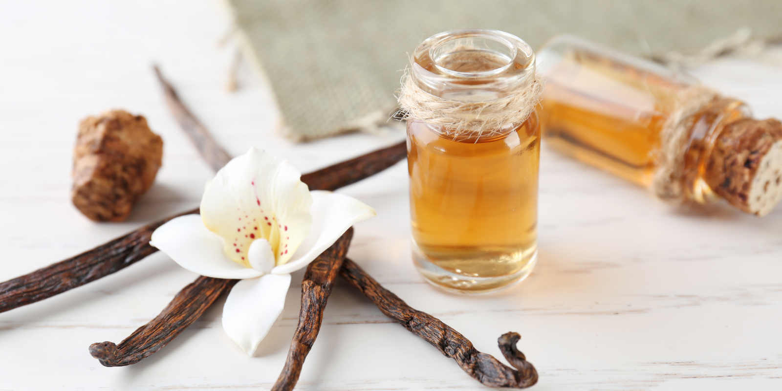 An image of anilla and perfumes nearby