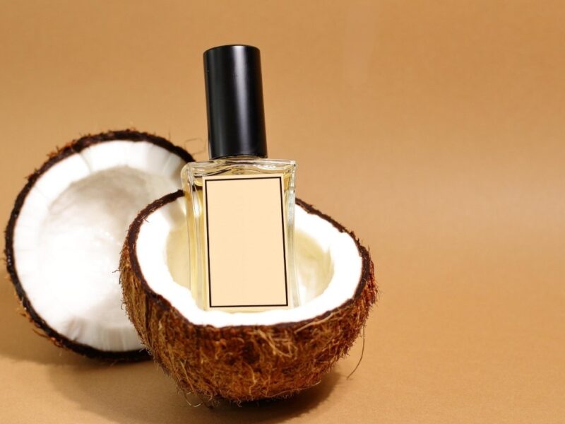 An image of a perfume and coconut