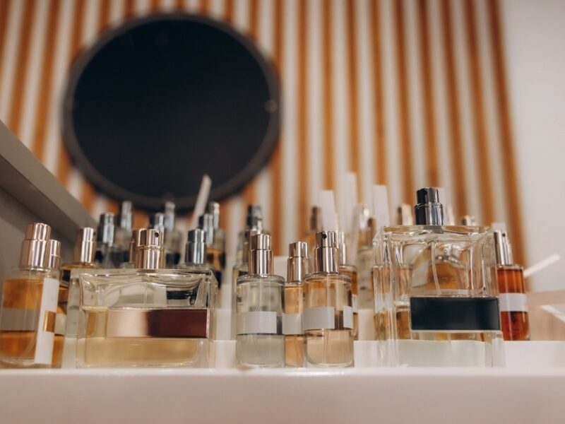 An image of perfumes in shelf